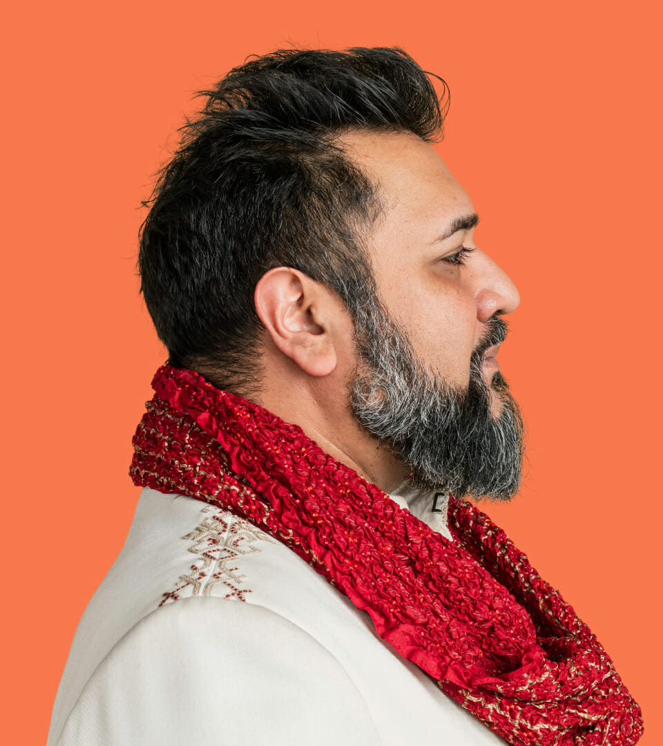 LSP software team portrait on IMS Pro's coral brand color